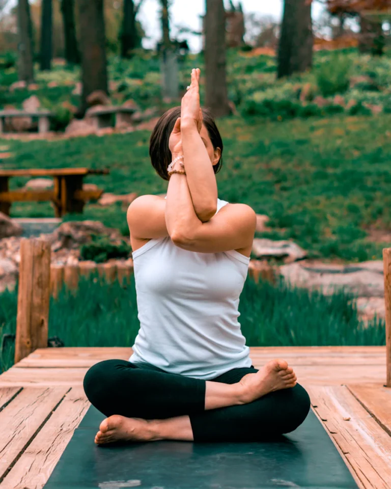 Woman practicing yoga outdoors